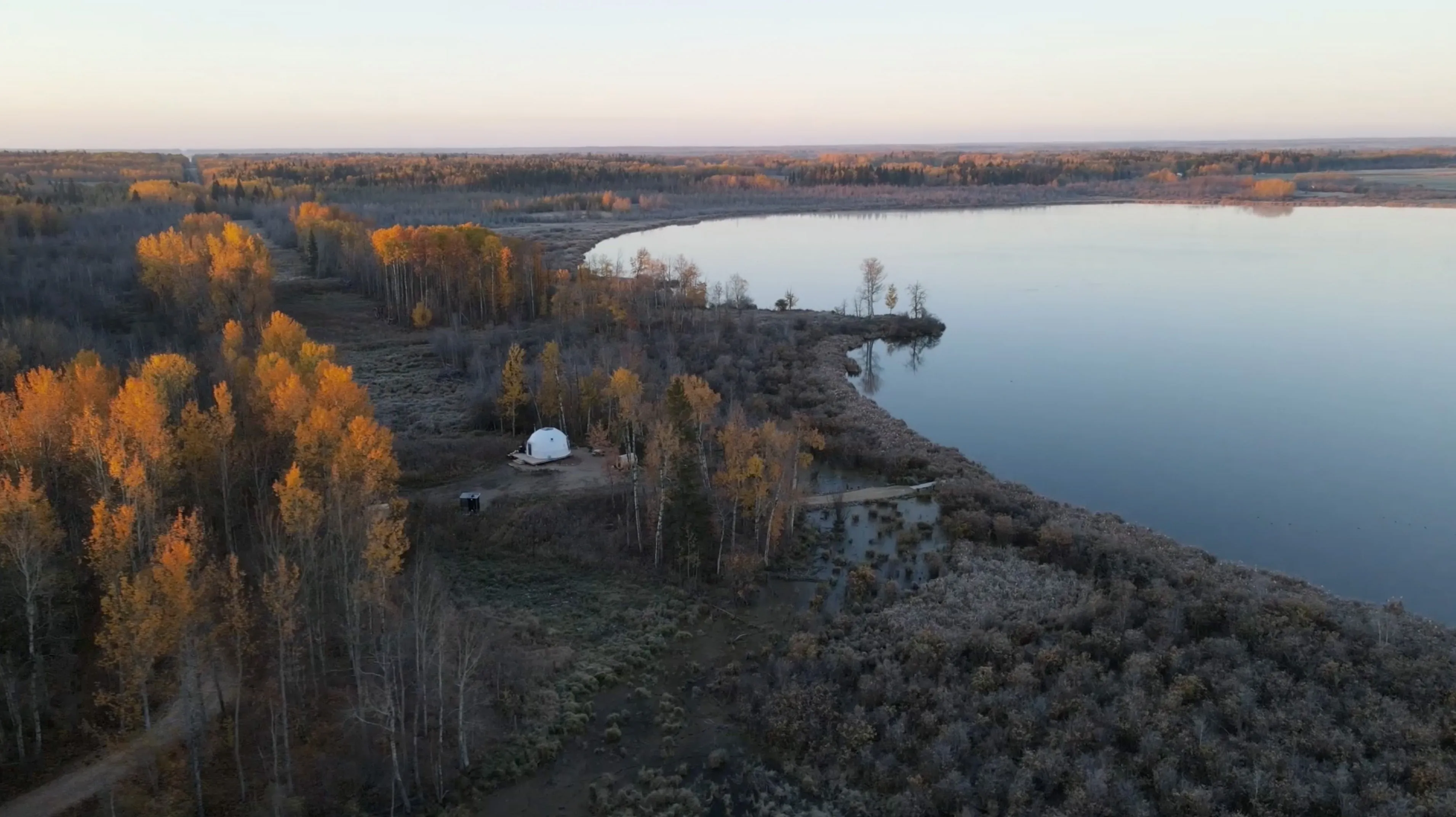 Large wide view of ignis dome with forest and lake